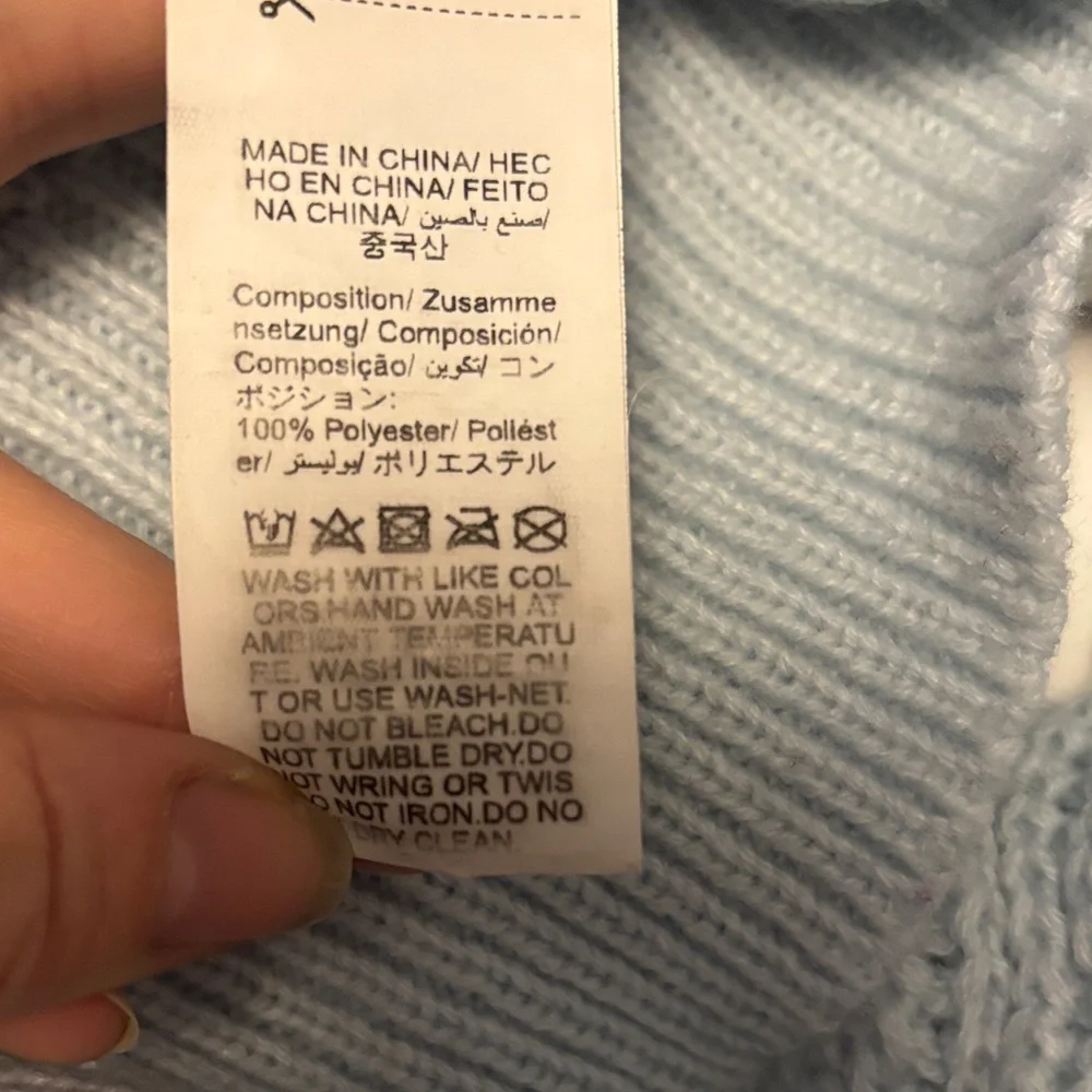 Elegant Light Blue Knit Sweater with Embellishments